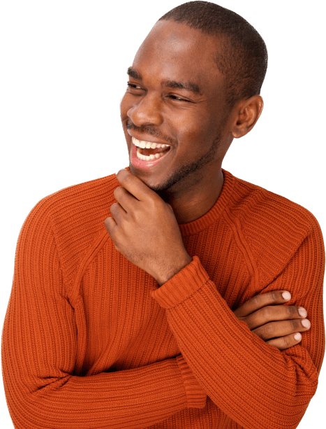 Man in orange sweater laughing