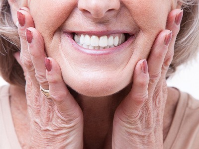A woman wearing dentures