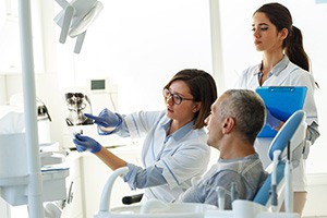 Patient in Fort Worth talking to dentist about a root canal