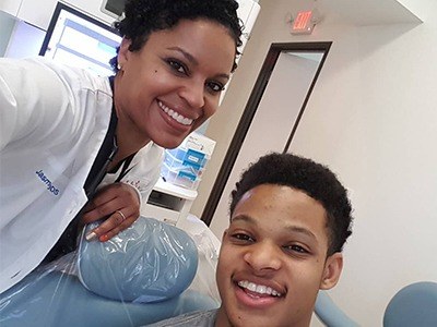 Doctor King smiling with Fort Worth dental patient