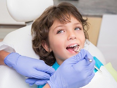 Young boy getting tooth colored fillings