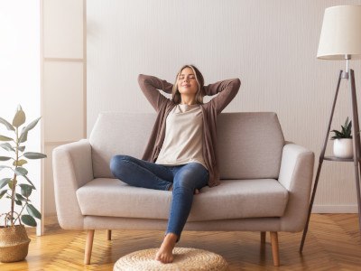 Woman relaxing on couch at home