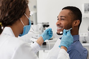 A young man receiving a dental checkup