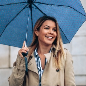 Woman holding blue umbrella