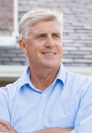 Older man in light blue button up shirt